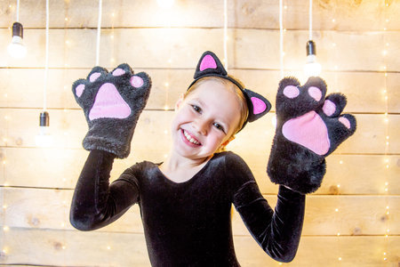 Portrait of a teen girl in a costume of a catの写真素材