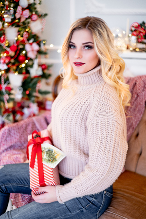 a woman in a christmas interior at homeの写真素材