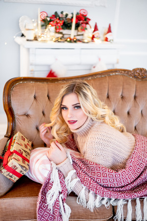 a woman in a christmas interior at homeの写真素材