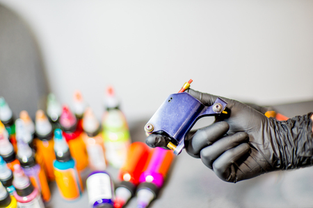 tattoo equipment machine and colorful ink in a workshopの写真素材