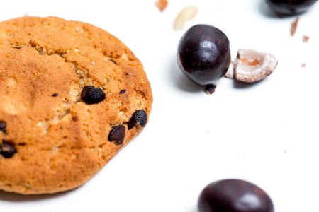 chocolate bar, shavings and cookies on a tableの写真素材
