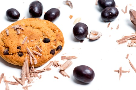 chocolate bar, shavings and cookies on a tableの写真素材