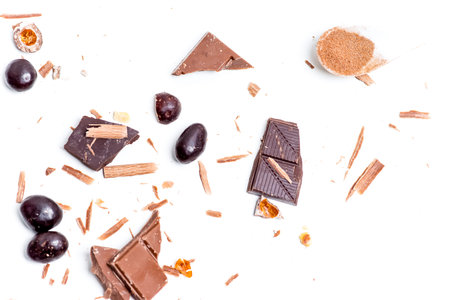 chocolate bar, shavings and cookies on a table