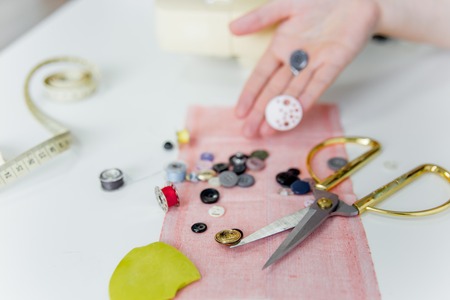 Creative sewing supplies and accessories on a tableの写真素材