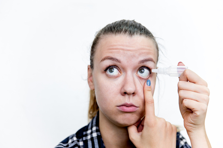 Young woman with bad eyesight with glasses and contact lensesの写真素材