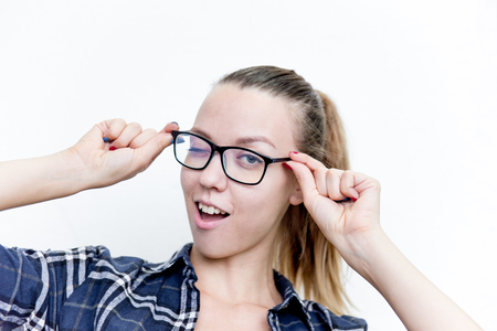 Young woman with bad eyesight with glasses and contact lensesの写真素材