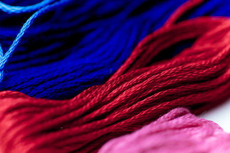 colorful sewing thread on a white table
