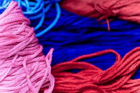 colorful sewing thread on a white table