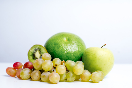 Creative layout made of fruits on a white backgroundの写真素材