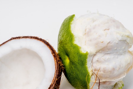 fresh open coconut on a white backgroundの写真素材