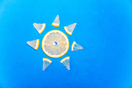 a banana and a lemon on colorful backgroundの写真素材
