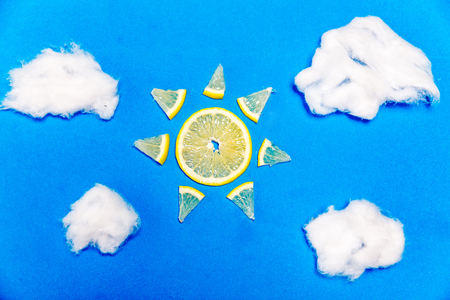 a banana and a lemon on colorful backgroundの写真素材