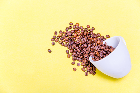 Coffee cup and coffee beans on white backgroundの写真素材