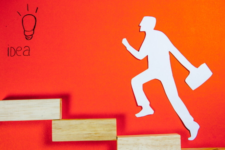 success concept - white man figure on a ladderの写真素材