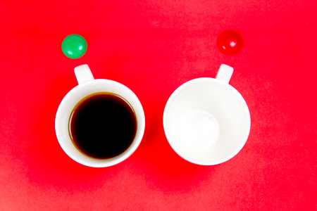 coffee is a fuel concept - a cup on a red backgroundの写真素材