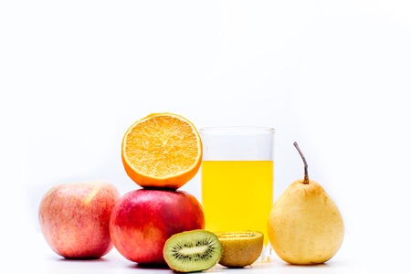 different fruit and juice or smoothie in a glassの写真素材