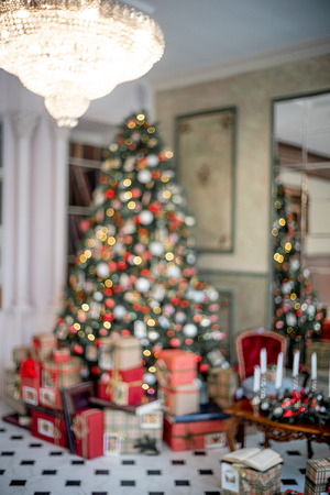 Christmas living room with a christmas tree and presents under itの写真素材