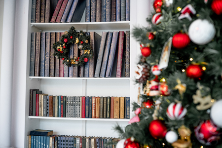 Christmas living room with a christmas tree and presents under itの写真素材