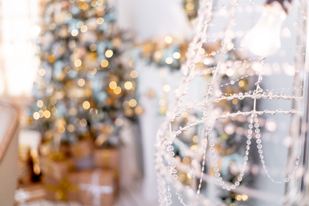 Christmas living room with a christmas tree and presents under itの写真素材
