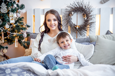 happy family is celebrating christmas together at homeの写真素材