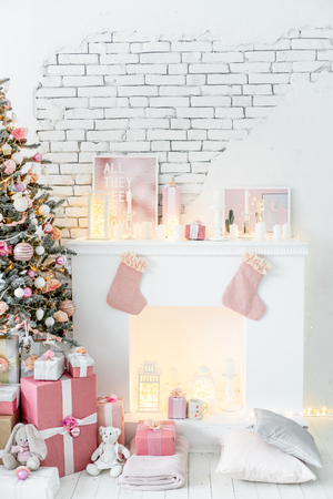 Christmas living room with a christmas tree and presents under itの写真素材