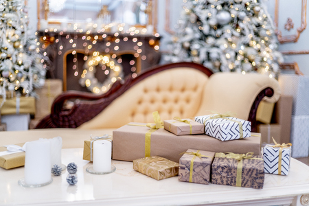 Christmas living room with a christmas tree and presents under itの写真素材
