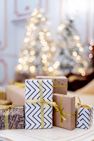 Christmas living room with a christmas tree and presents under itの写真素材