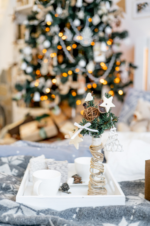 Christmas living room with a christmas tree and presents under itの写真素材