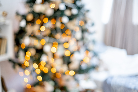Christmas living room with a christmas tree and presents under itの写真素材