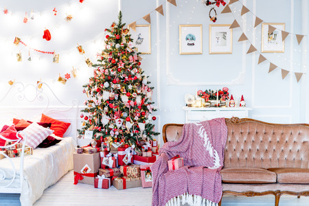 Christmas living room with a christmas tree and presents under itの写真素材