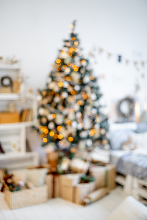 Christmas living room with a christmas tree and presents under itの写真素材