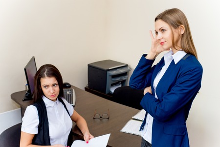 two young beautiful businesswomen in an officeの写真素材