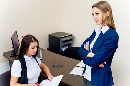 two young beautiful businesswomen in an officeの写真素材