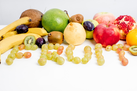 Creative layout made of fruits on a white backgroundの写真素材