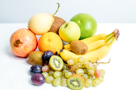Creative layout made of fruits on a white backgroundの写真素材