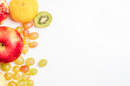 Creative layout made of fruits on a white backgroundの写真素材