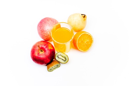 different fruit and juice or smoothie in a glassの写真素材