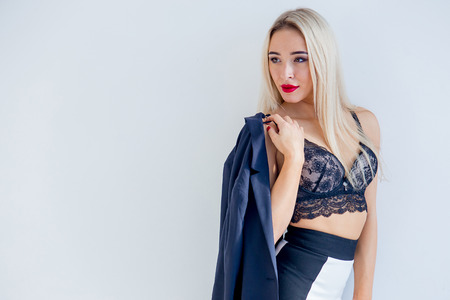 a businesswoman or a secretary in a jacket and lingerieの写真素材