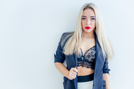 a businesswoman or a secretary in a jacket and lingerieの写真素材