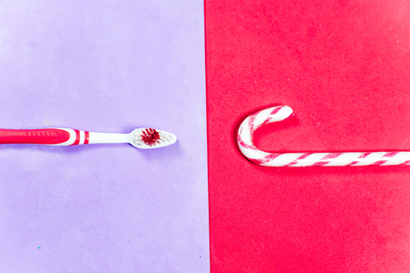 toothbrushes and a toothpaste on a colorful backgroundの写真素材
