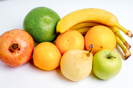Creative layout made of fruits on a white backgroundの写真素材