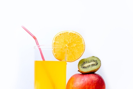 different fruit and juice or smoothie in a glassの写真素材