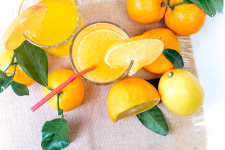 different fruit and juice or smoothie in a glassの写真素材