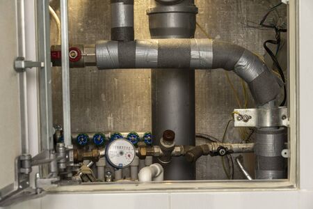 turn off hot water. plumbing cabinet. water meters, collector, water pressure sensorの写真素材