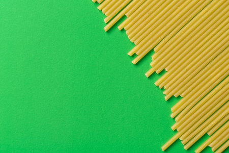 spaghetti on a green background, copy space