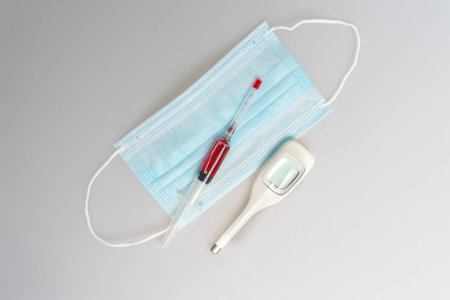 syringe with red liquid, disposable mask, tablets in a blister, empty blisters for tablets,...