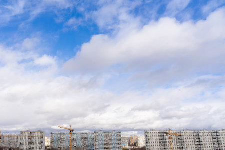 roofs of multi-storey buildings and beautiful sky with clouds