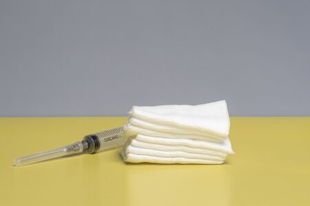 injection kit, syringe and sterile wipes on a yellow background. antiviral treatmentの写真素材