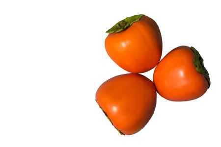 three persimmons on a white background without a shadowの写真素材
