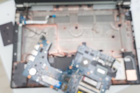 disassembled dusty laptop closeup. blurred backgroundの写真素材